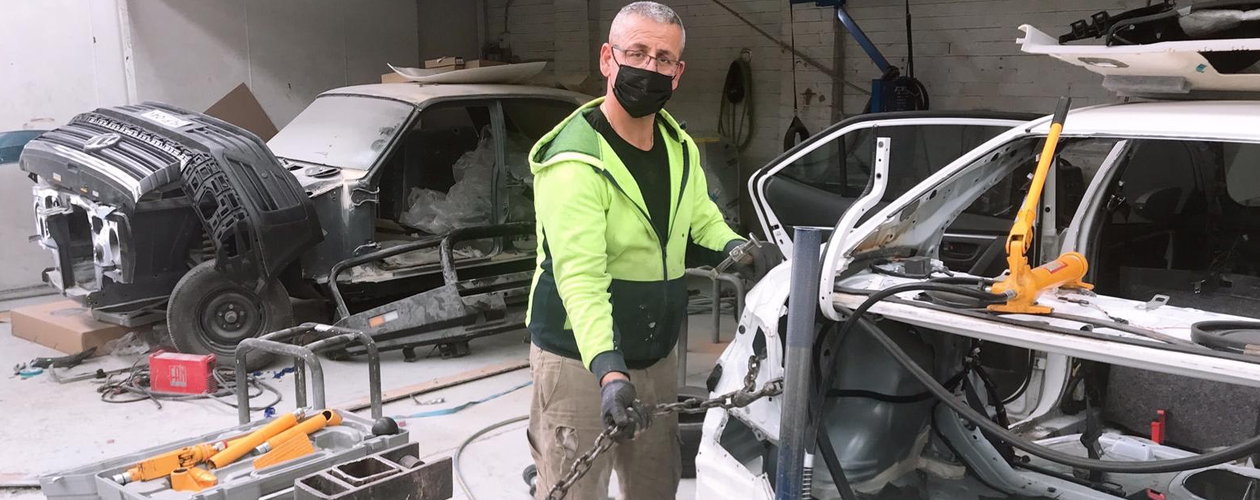 Yousif working on a car