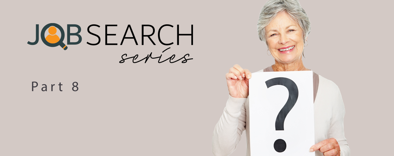 older woman holding question mark