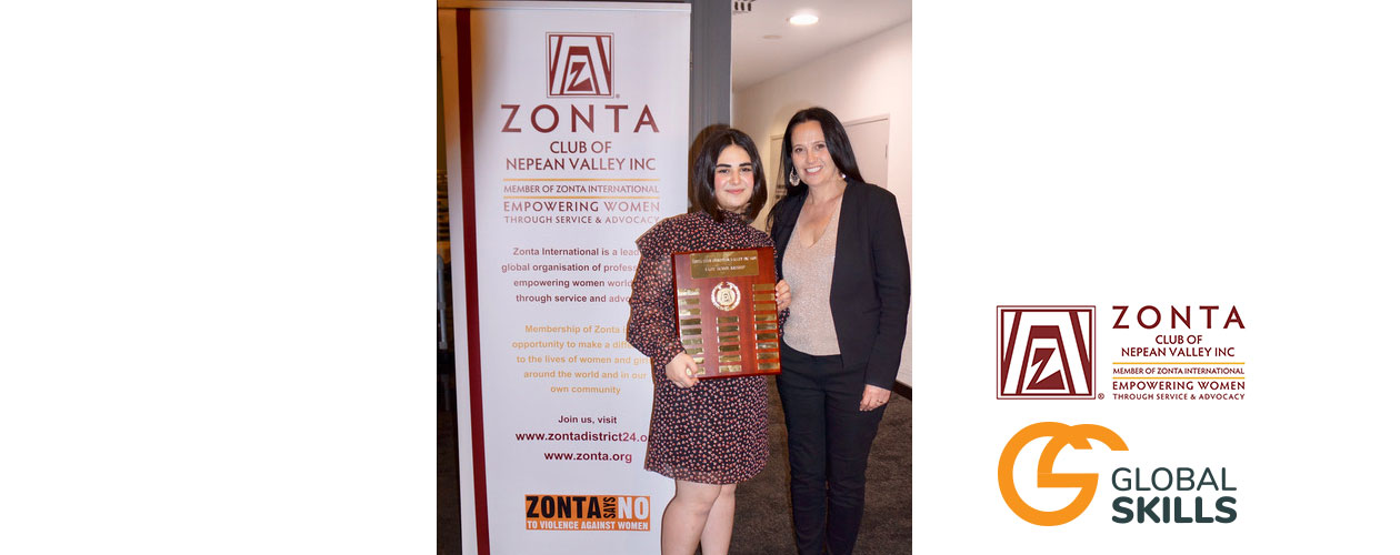 Global Skills Managing Director Rebecca and award winner standing in front of Zonta banner