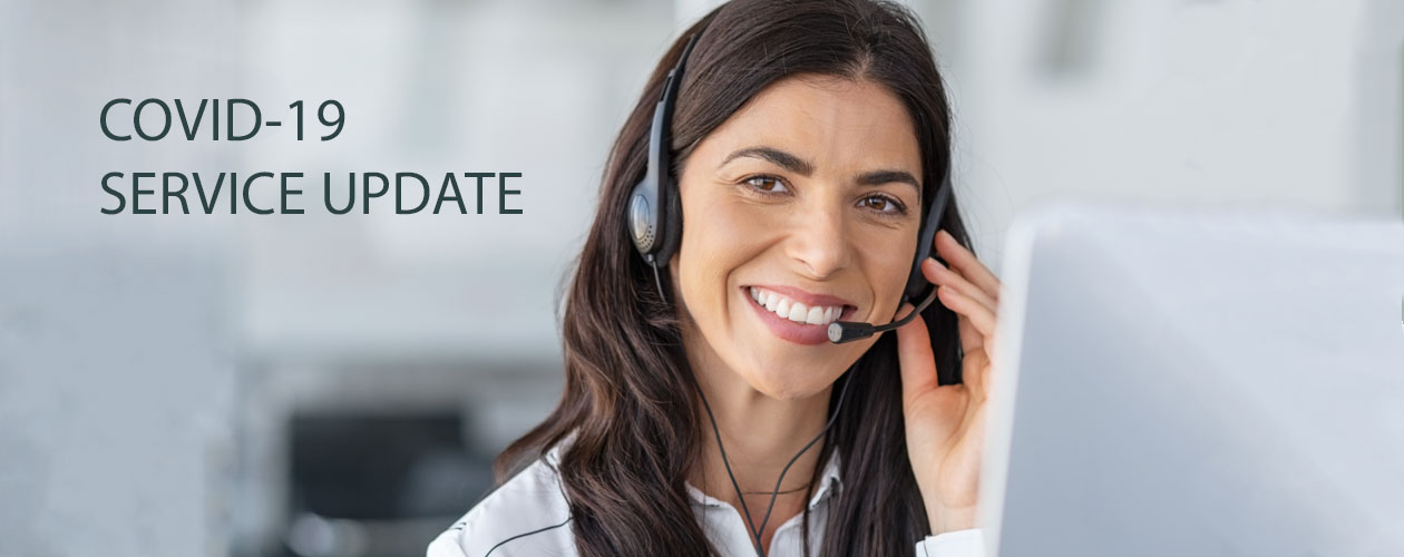 woman with headset working on laptop
