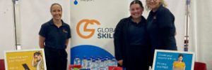 staff at our stall, table includes branded merchandise