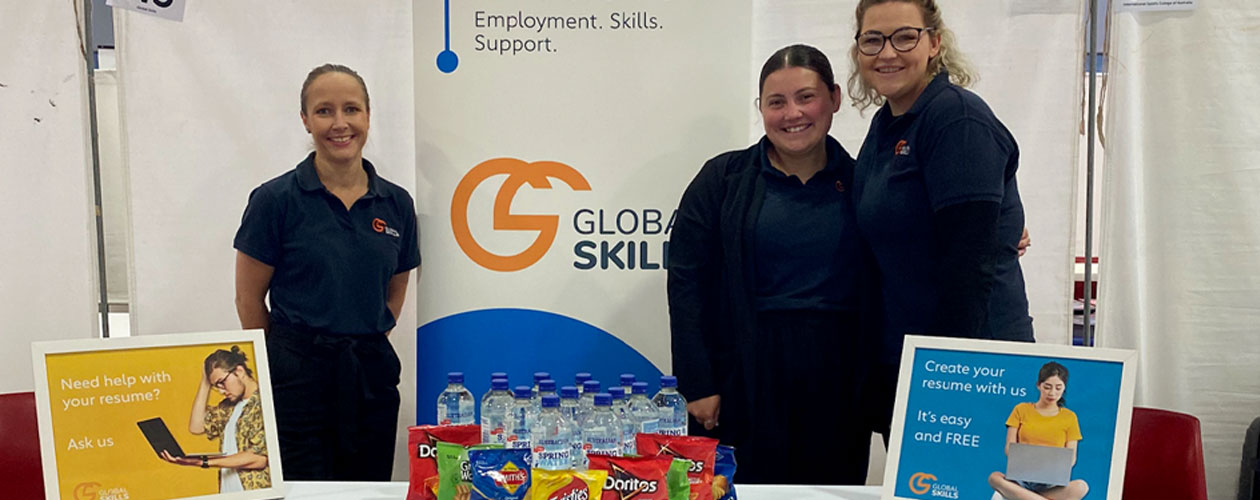 staff at our stall, table includes branded merchandise