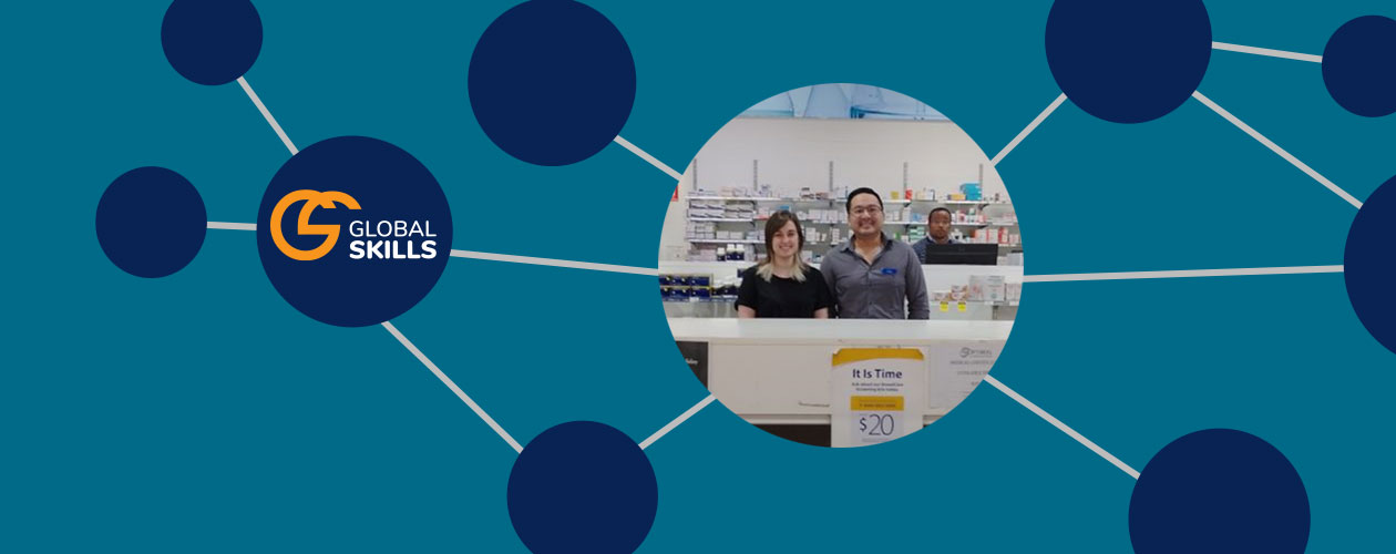 Madelen and her employer standing behind pharmacy counter