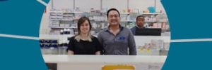 Madelen and her employer standing behind pharmacy counter