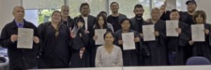 graduates holding certificates