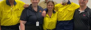 graduates with trainer and global skills staff