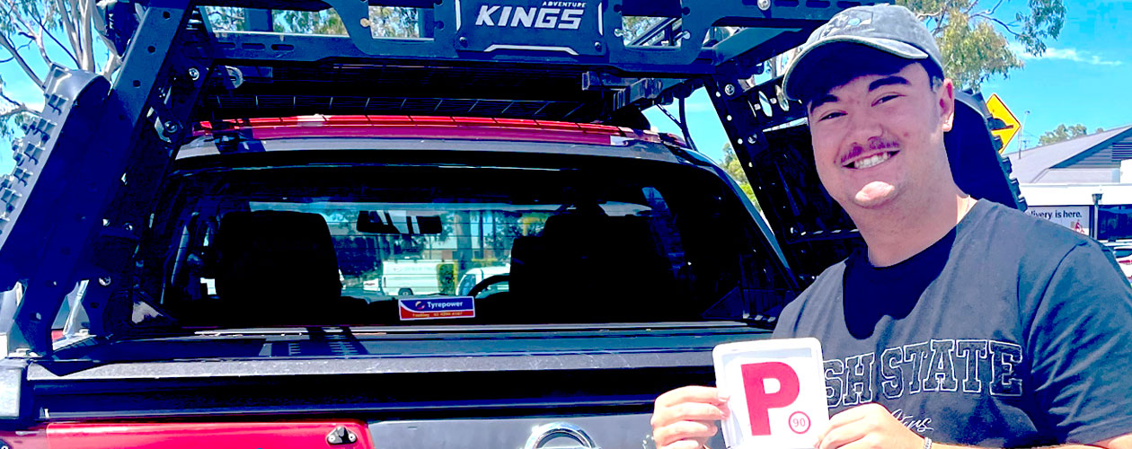 Lam holding a p-plate