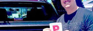 Lam holding a p-plate