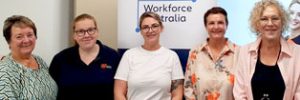 our staff with ARA staff standing in front of our banner