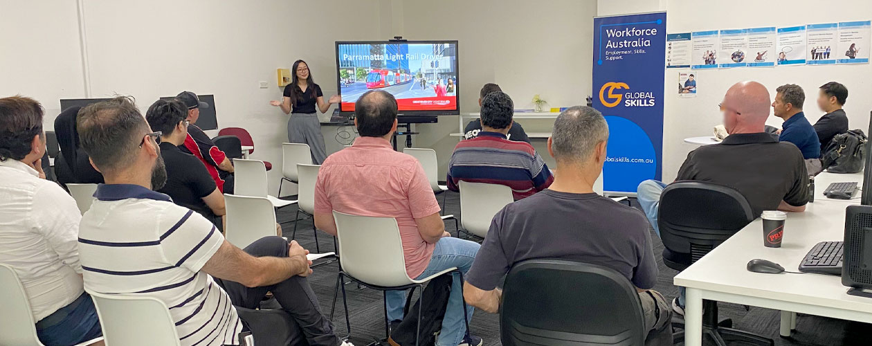 job seekers watching presentation by employer