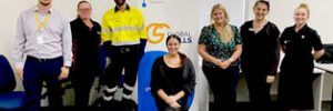 employers and Global Skills Staff standing around our banner