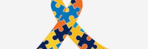 Autism ribbon made up of coloured jigsaw puzzle pieces
