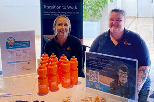 2 TtW staff sitting at our stall