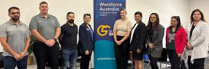 employers and Global Skills staff standing around our banner