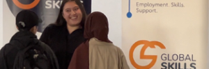 Staff member chatting to 2 women at our stall