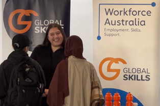 Staff member chatting to 2 women at our stall
