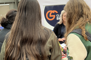 Victoria chatting to young people at our stall