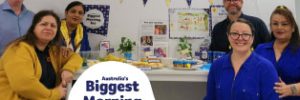 Our Brookvale team in blue and yellow with their Biggest Morning Tea themed morning tea