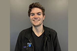 Lachlan wearing his Community Champion badge