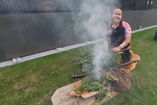 Eucalyptus leaves burning as part of the smoking ceremony performed on the day