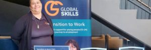 Jennifer is behind the table at our stall, with Global Skills' Workforce Australia banner beside her
