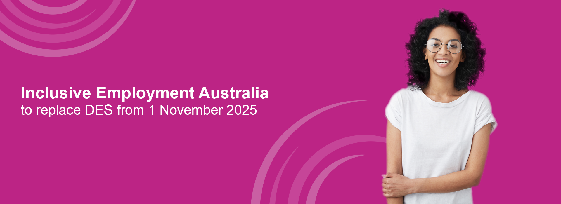 dark, curly haired woman wearing a white shirt and glass standing again a pink background. Text includes IEA to replace DES 1 November
