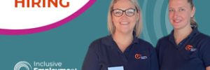 2 staff members in logo shirts under the words 'we are hiring'