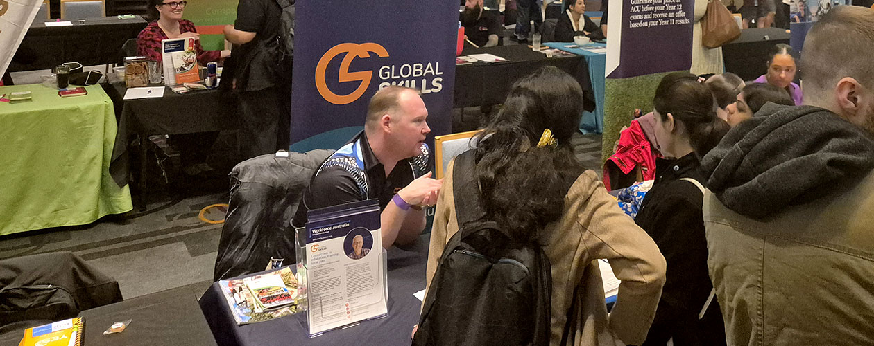 Trent conversing with attendees at our stall during the expo