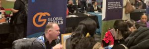 Trent conversing with attendees at our stall during the expo