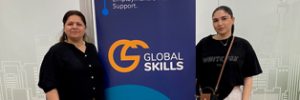 Azita and Mariam standing on either side of a Global Skills banner that reads "Workforce Australia: Employment. Skills. Support." The banner includes the Global Skills logo and website.