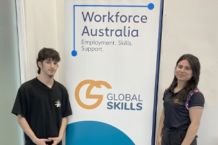 Mazin with his Employment Consultant, Jeena, standing beside Global Skills’ Workforce Australia banner