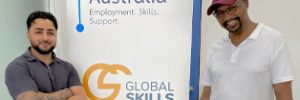 Youssef and Colin standing either side of Global Skills’ Workforce Australia banner at Global Skills Fairfield.