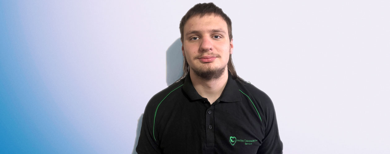 James wearing a black polo shirt with green trim and an Autism Community Care Services logo. Workforce Australia and Global Skills logos appear in the bottom right of the image.