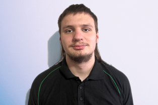 James wearing a black polo shirt with green trim and an Autism Community Care Services logo. Workforce Australia and Global Skills logos appear in the bottom right of the image.