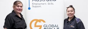 Ofa and Chevaugh standing on either side of Global Skills’ Workforce Australia banner. The banner displays Workforce Australia branding above our Global Skills logo.