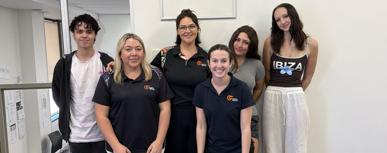 Transition to Work staff standing with Youth Advisory Group participants at Global Skills Wyong. Workforce Australia and Global Skills logos appear in the bottom right corner.