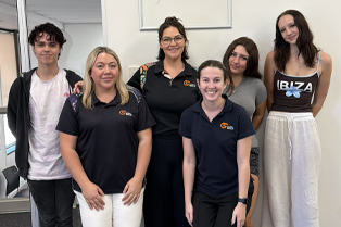 Transition to Work staff standing with Youth Advisory Group participants at Global Skills Wyong. Workforce Australia and Global Skills logos appear in the bottom right corner.