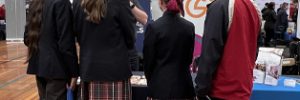 Students at the Global Skills stand at the Macarthur Careers Expo, speaking with staff about career pathways and employment support.