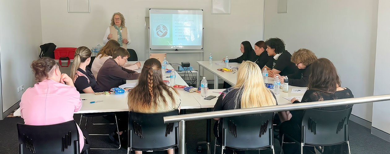 Steady Minds participants seated around tables in Global Skills’ training room, engaging with the workshop facilitator. Workforce Australia and Global Skills logos appear at the bottom of the image.