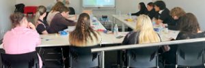 Steady Minds participants seated around tables in Global Skills’ training room, engaging with the workshop facilitator. Workforce Australia and Global Skills logos appear at the bottom of the image.