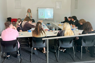 Steady Minds participants seated around tables in Global Skills’ training room, engaging with the workshop facilitator. Workforce Australia and Global Skills logos appear at the bottom of the image.