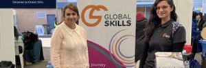 Two Global Skills team members at our stall at the FECAP Pathways to Employment Expo, with information and resources available for attendees.