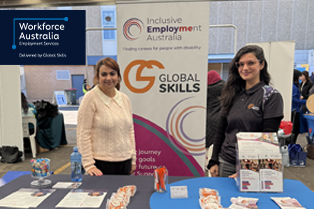 Two Global Skills team members at our stall at the FECAP Pathways to Employment Expo, with information and resources available for attendees.