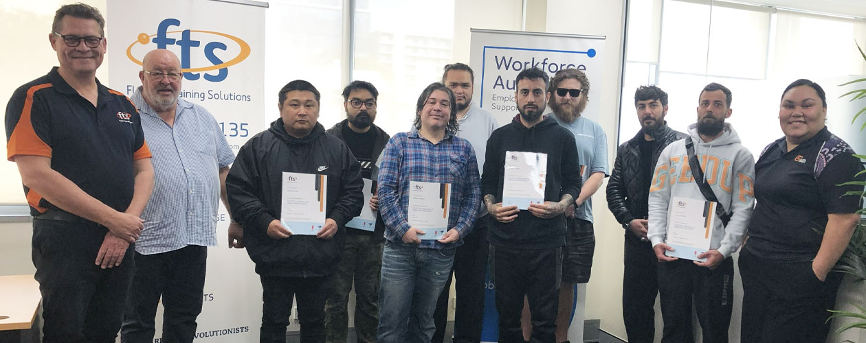 Graduating students are pictured with Kelvin Mendoza and Andrew Gifford from Flexible Training Solutions, alongside Juliana.