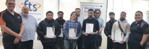 Graduating students are pictured with Kelvin Mendoza and Andrew Gifford from Flexible Training Solutions, alongside Juliana.