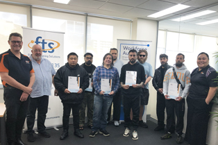 Graduating students are pictured with Kelvin Mendoza and Andrew Gifford from Flexible Training Solutions, alongside Juliana.